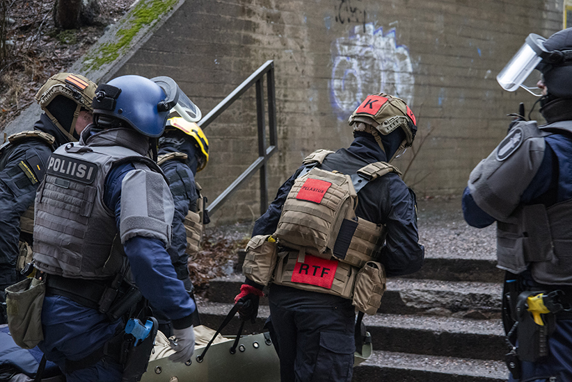 Firefighters and police officers in protective gear