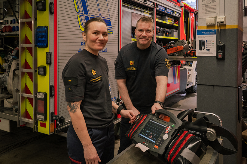 Firefighter paramedics Suvi and Saku in the equipment hall