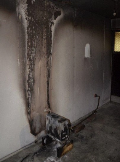 Palamaan syttynyt ilmanlämmitin varastotilassa.