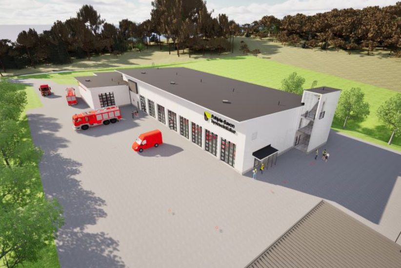 Havainnekuva pelastusasemasta, jonka pihalla on hälytysajoneuvoja.